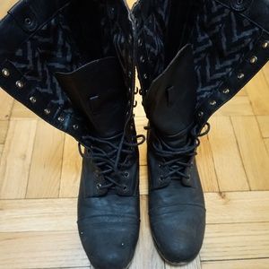 Edgy charcoal gray lace-up boot w/ rustic feel